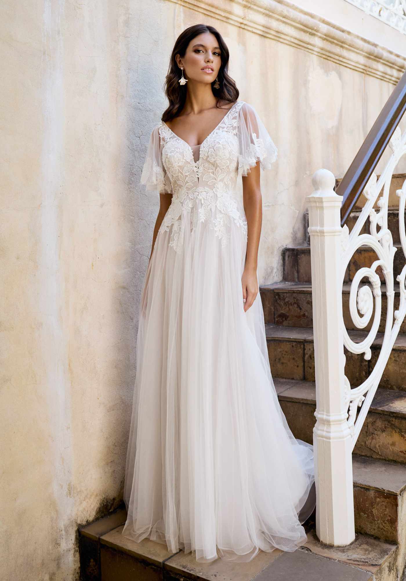 Whimsical A-line tulle and lace gown with detachable sleeves Kelsey Rose Whimsical A-line tulle and lace gown with detachable sleeves Kelsey Rose