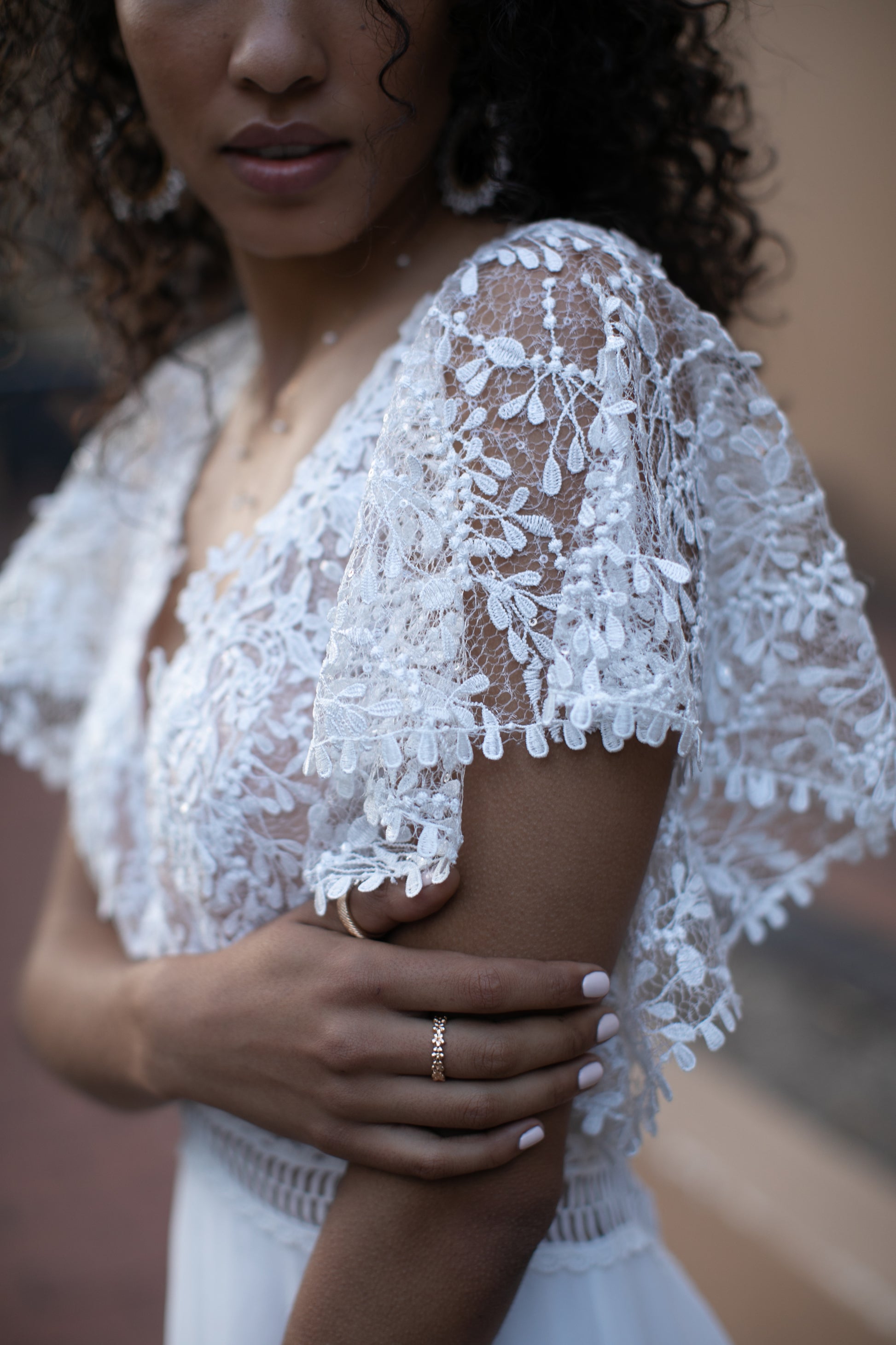 Efforless and flattering, this ivory A-line wedding dress is complete with a V-neckline, empire waistline and keyhole-back detail. Kelsey Rose Efforless and flattering, this ivory A-line wedding dress is complete with a V-neckline, empire waistline and keyhole-back detail. Kelsey Rose