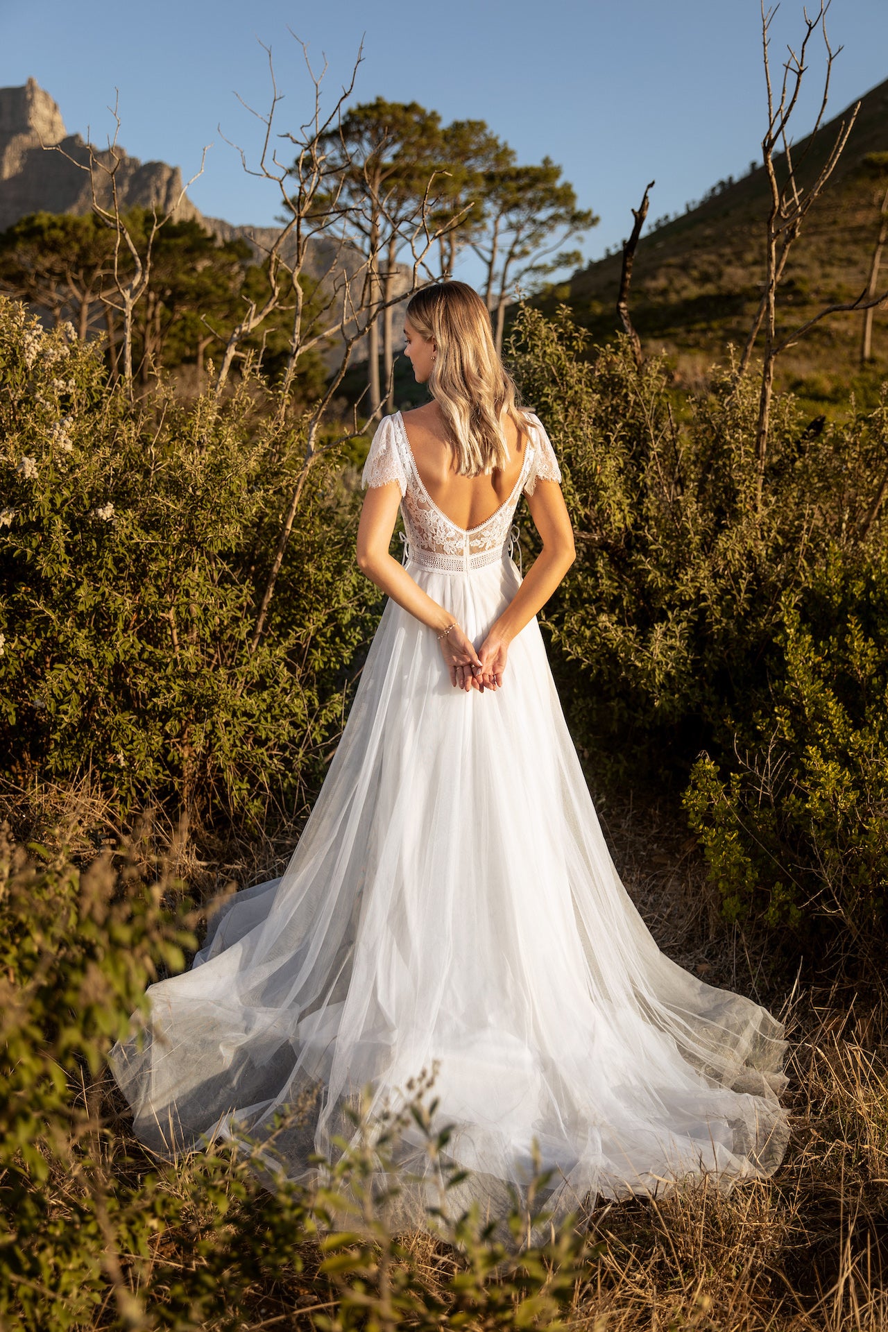 Boho wedding dress in lace and tulle with lace up detail. Kelsey