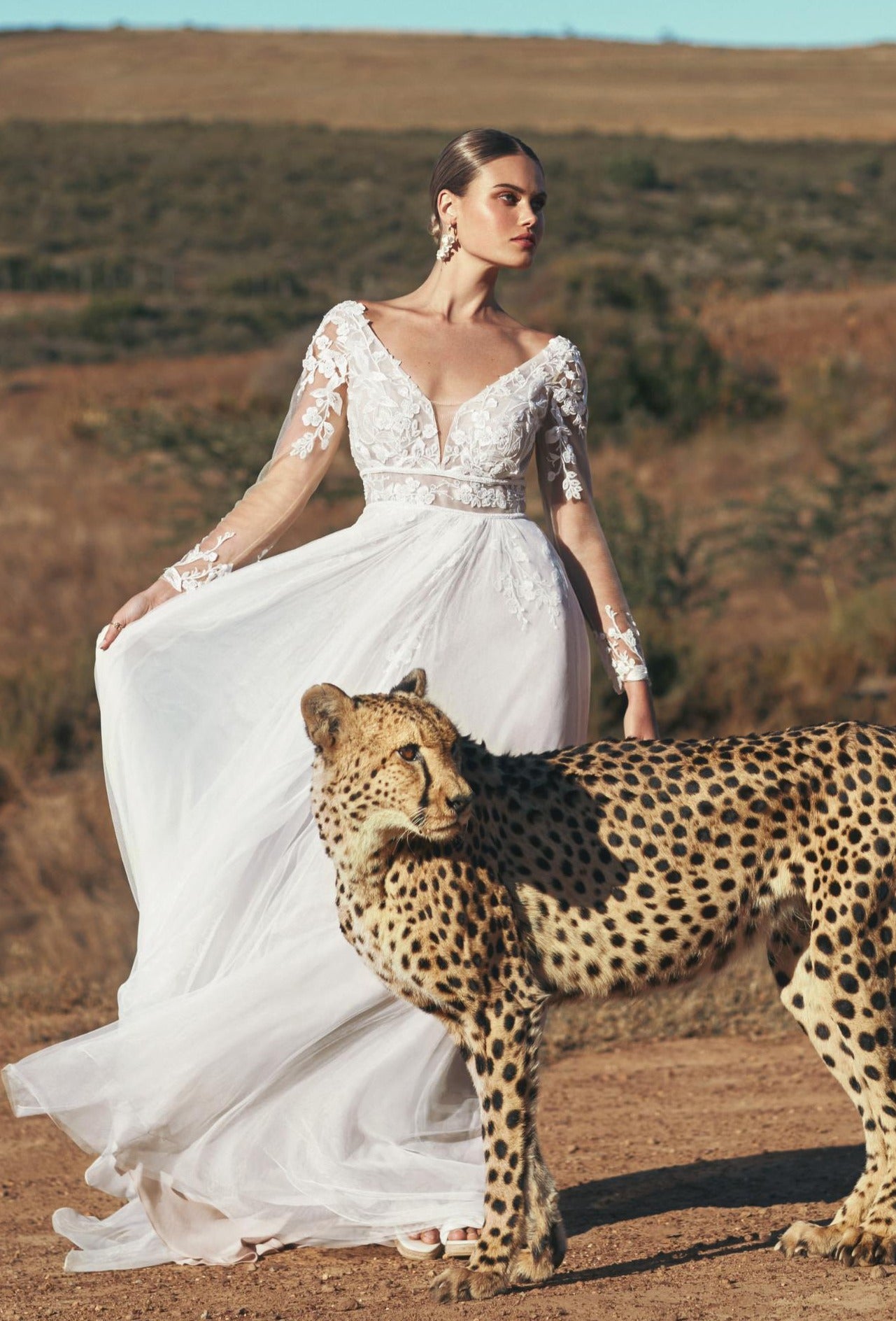 Feminine beaded lace and tulle wedding dress wiht long sleeves designed for the romantic bride. Kelsey Rose